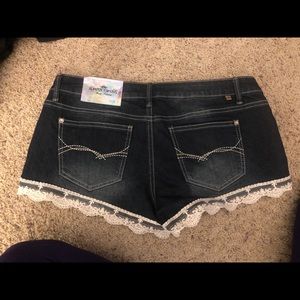 Dark wash jean shorts with lace trim